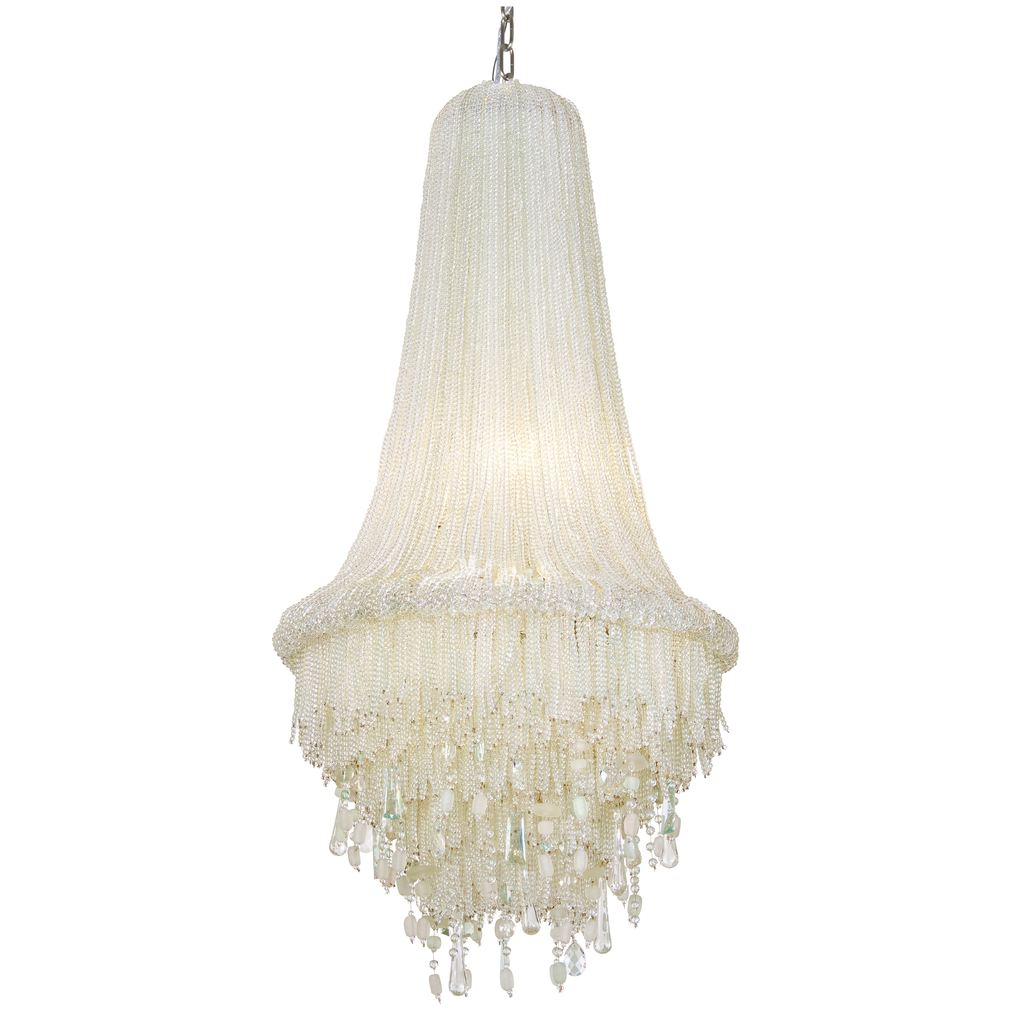 The Crystal Reign pendant beautifully blends crystal sophistication with sea glass accents for a fresh coastal-contemporary aesthetic. Its polished nickel finish and generous 19.5-inch width make it a stunning focal point.