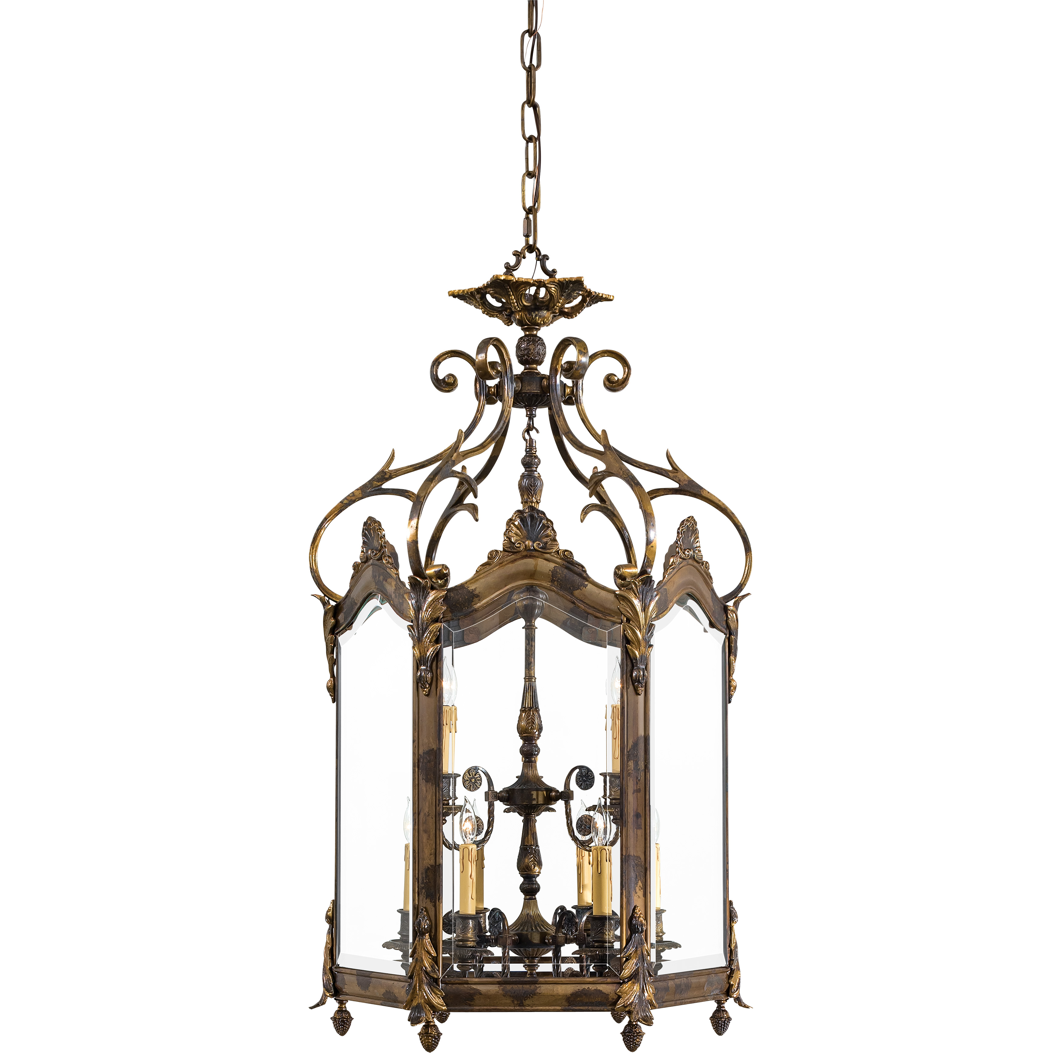 This handcrafted Italian pendant brings European sophistication to grand entryways with its lost wax casting technique and oxide brass finish. Nine candelabra lights behind clear beveled glass create dramatic illumination.
